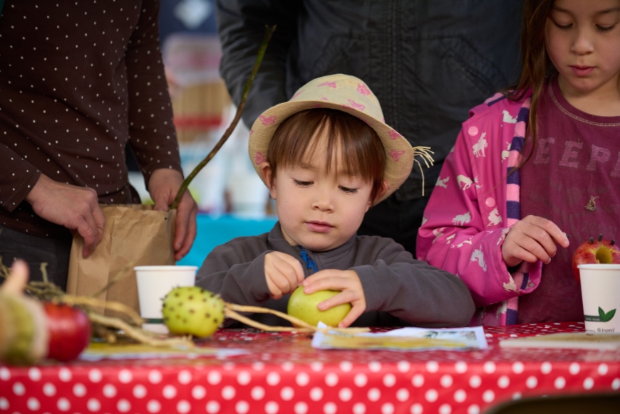 Apple themed craft activities for the families during the Apple festival in the Orchard at Avebury, Wiltshire